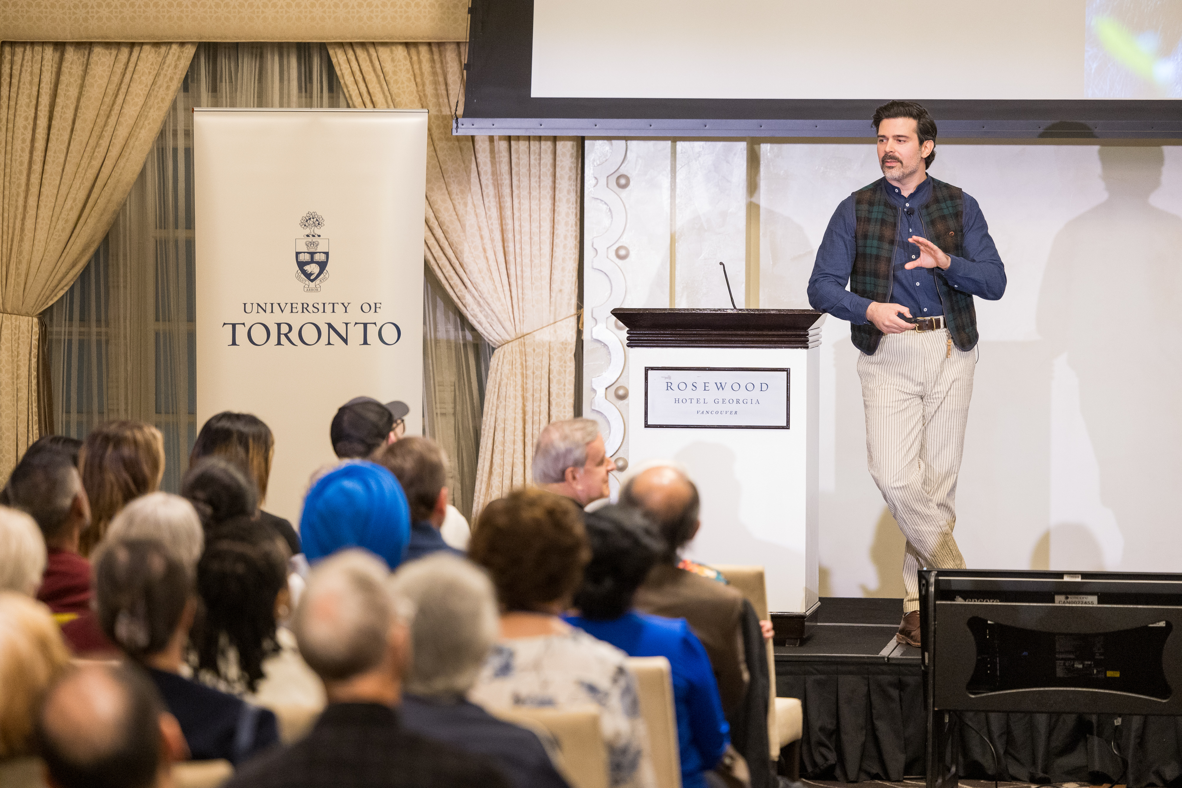 David Samson speaking to an audience at a University of Toronto alumni event in Vancouver